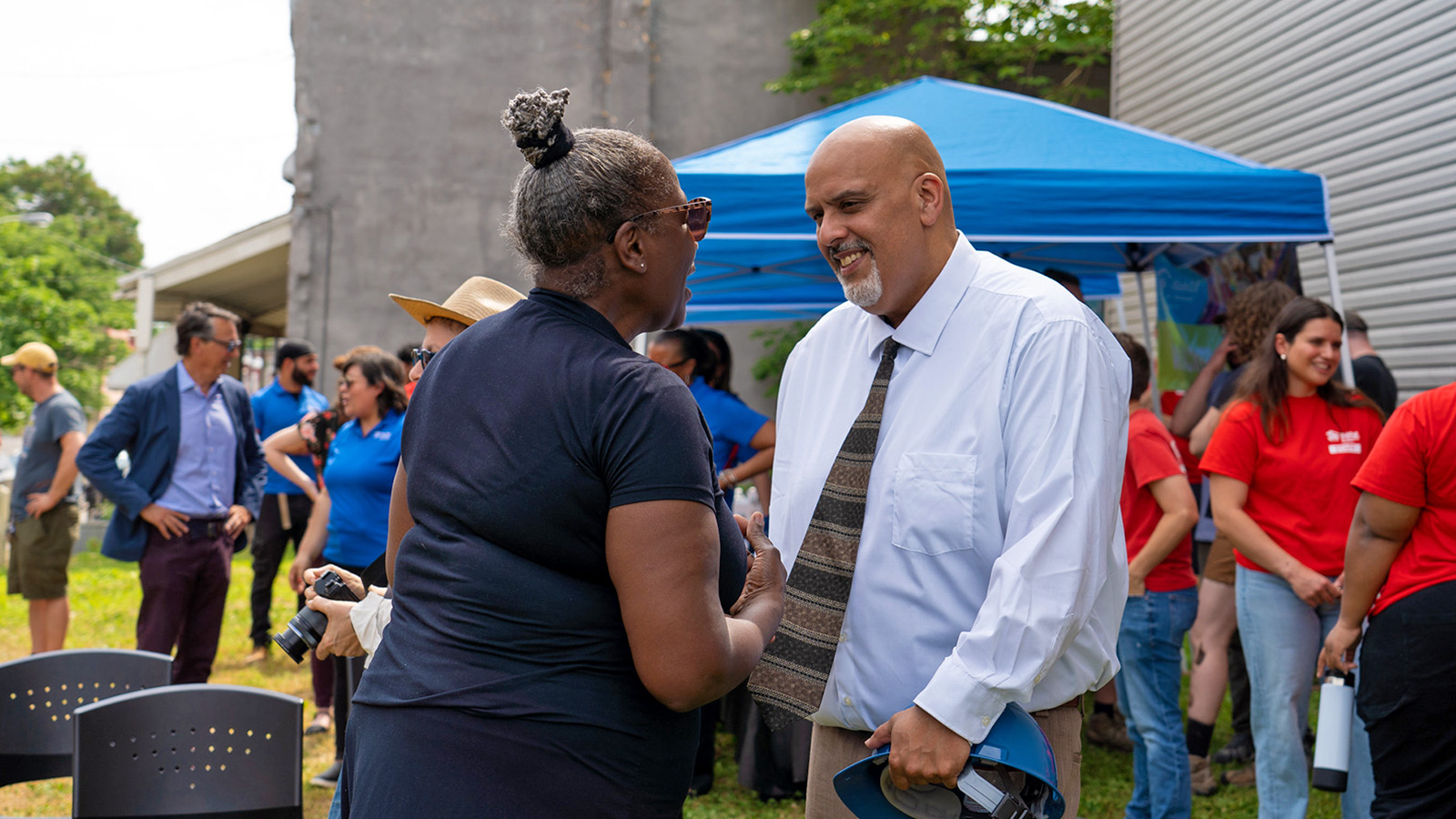 Photo of Habitat homeowner with Floyd Lebron at groundbreaking ceremony